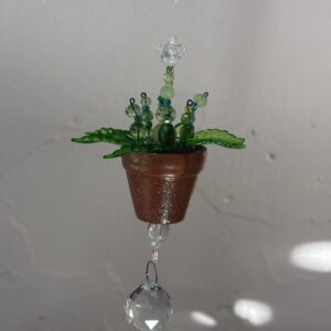 Light green plant with round prism accent & hummingbird charm 2" pot
