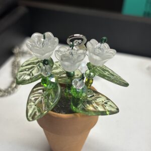 White flowers in plain terra cotta 1" pot