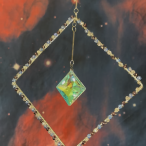 Diamond shaped frame, wrapped in blue, purple, & clear beads, with prism